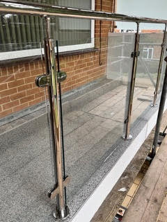 Chrome and glass balustrade balcony refurbishment on a Bournemouth block